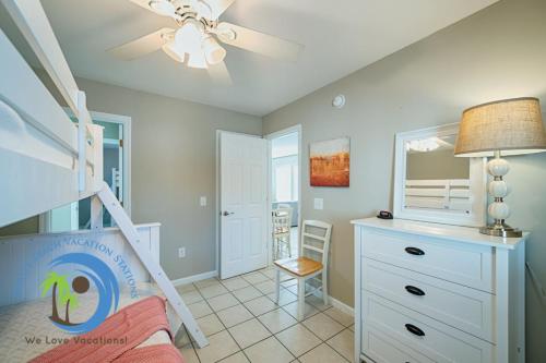 a childs bedroom with a bunk bed and a desk at Sandcastle Down in Myrtle Beach
