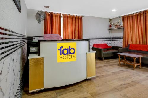 a living room with a jobhorses sign on a table at FabHotel Aavkar in Sātej