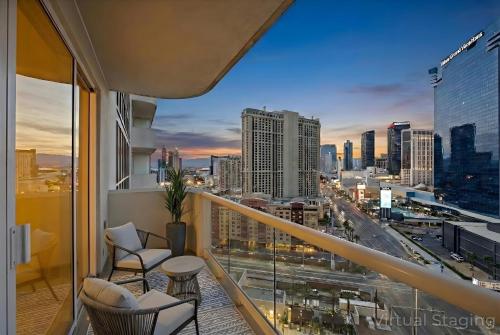a balcony with chairs and a view of a city at Balcony Full Strip View Suite MGM Signature FREE VALET in Las Vegas