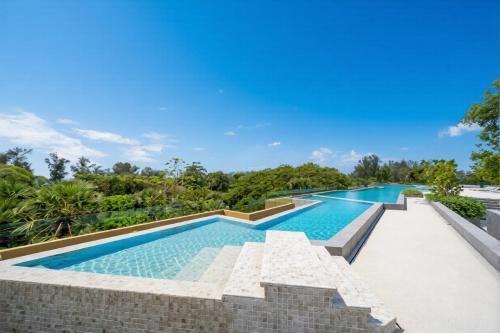 an image of a swimming pool in a house at Laguna Beachside residences apartamens, walking distance to the sea in Bang Tao Beach