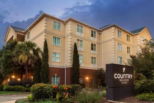 a building with a sign in front of it at Country Inn & Suites by Radisson, Athens, GA in Athens