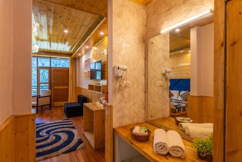 a bathroom with a shower in a room at The 14 Gables, A Boutique Stay, Manali - Pet Friendly - Balcony Rooms - Crown Palace in Manāli