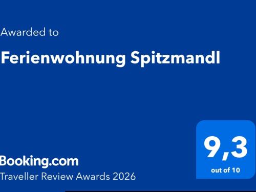 a blue sign with the words referring to aernessgiving spireimant on at Ferienwohnung Spitzmandl in Innsbruck