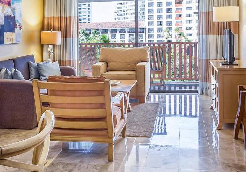 a living room with a couch and a table at Meliá Puerto Vallarta in Puerto Vallarta