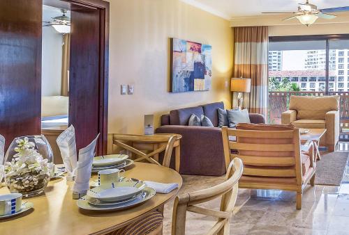 a living room with a table and a couch at Meliá Puerto Vallarta in Puerto Vallarta