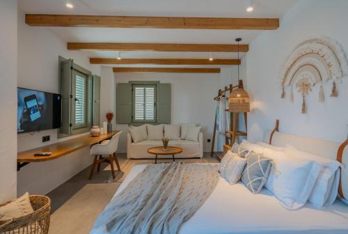 a bedroom with a bed and a living room at Carpe Diem Boutique Hotel - Adults Only in Side