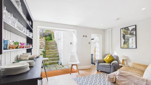 a living room with a couch and a chair at Arden Villa, sleeps 8, moments from the golden sandy beach of Ryde in Ryde