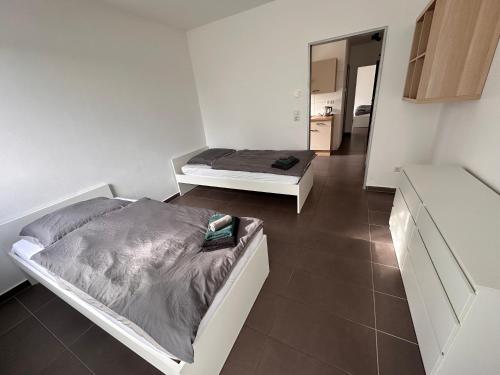 a bedroom with two beds in a room at AM Apartment 8 in Gronau