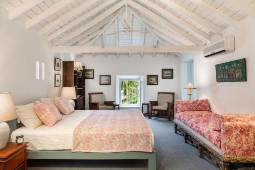 a bedroom with a bed and a couch at Clingendael Weligama in Weligama