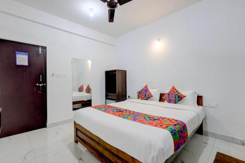 a bedroom with a large bed in a room at FabHotel Crystal Bay Baga in Baga