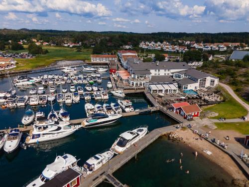 an aerial view of a marina with boats in the water at TanumStrand SPA & Resort in Grebbestad