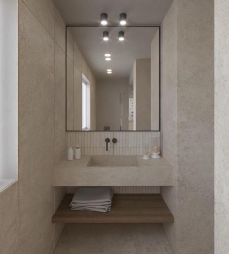 a bathroom with a sink and a mirror at Ammos Boutique Apartments & Suites in Malia