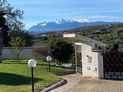a house with a view of a snow covered mountain at GinKgo B&B in Francavilla al Mare
