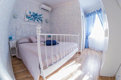 Кровать или кровати в номере Flores B&B