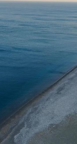 an aerial view of a body of water at Seapalm Villa - Elegant Stay - Steps from the Sea in Lachania