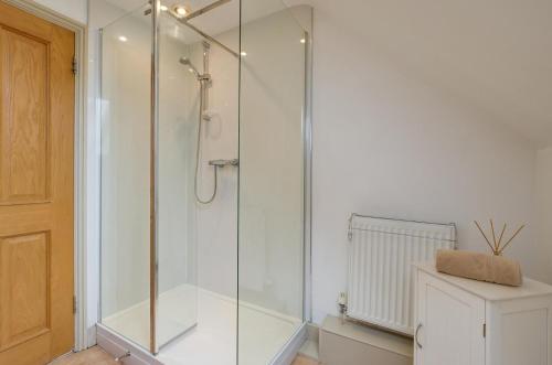 a glass shower in a bathroom with a toilet at 1 Bed in Swannington oc-2206 in Attlebridge
