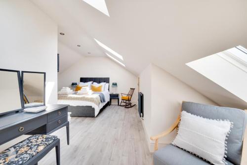 a attic bedroom with a bed and a desk at 3 Bed in Trawsfynydd oc-wag718 in Trawsfynydd