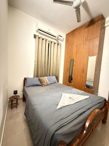 a bedroom with a large bed in a room at Moonstone Royal Resort in Jāmb