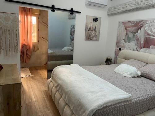 a bedroom with two beds in a room at chez Jess chambre d'hôte a UZES in Uzès
