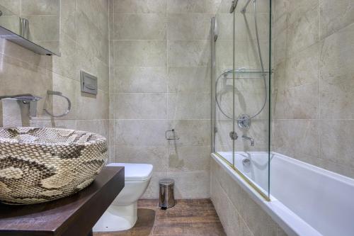 a bathroom with a sink and a toilet and a shower at Stunning 3BR breathtaking views outdoor dining in Rabat