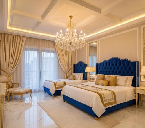 a large bedroom with two beds and a chandelier at Awex Apart in Sakarya