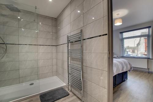 a bathroom with a shower and a bath tub at 5 Bed in Bala oc-bow163 in Bala