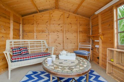 a room with a table and chairs in a cabin at 2 Bed in Walcott oc-2209 in Walcott