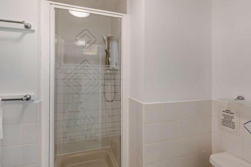 a shower with a glass door in a bathroom at 2 Bed in Putsborough oc-f27451 in Croyde