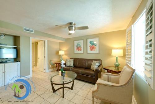 a living room with a couch and a table at Windy Hill Villa 3 - Beach Charm in Myrtle Beach