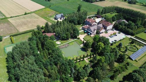 an overhead view of a large estate with a house at Hotel Chabrowy Dworek in Teresin