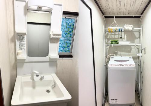 a bathroom with a sink and a mirror at Nishijin Stay One in Fukuoka