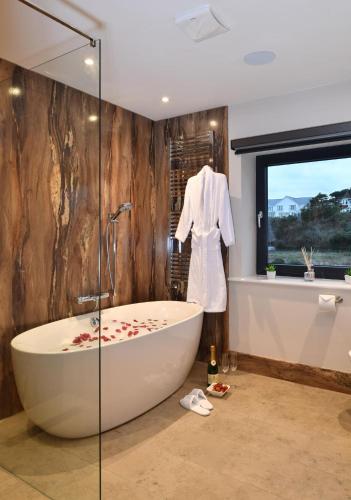 a bathroom with a bath tub and a window at 5 Bed in Walmer oc-do022 in Kingsdown