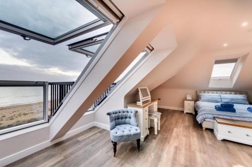 a bedroom with a bed and a desk and a window at 5 Bed in Walmer oc-do022 in Kingsdown