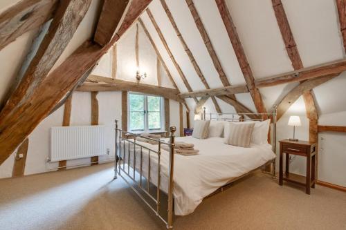 a bedroom with a bed in a attic at 5 Bed in Finningham oc-obhf in Finningham
