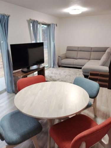 a living room with a table and chairs at Seaside House Cozy - Vacation STAY 03320v in Sanmu