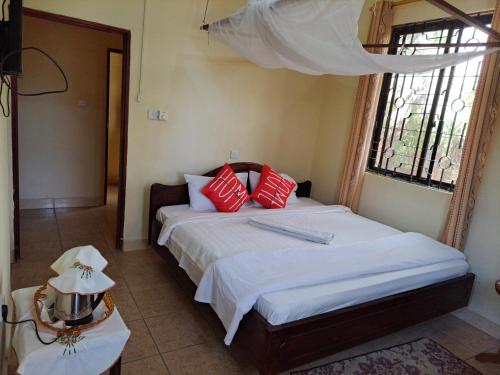 Llit o llits en una habitació de Rainbow Executive Lodge