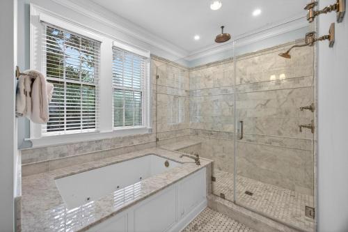 a large bathroom with a tub and a shower at GE317: 317 Glen Eagle in Kiawah Island