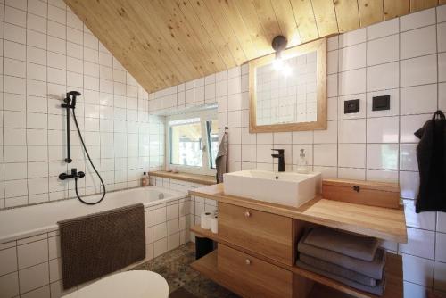 a bathroom with a sink and a tub and a sink at Příchvoj 8 Český ráj in Sobotka