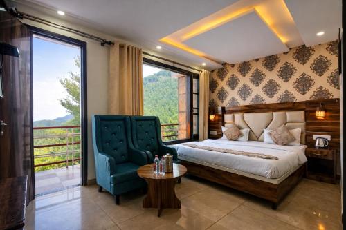 a bedroom with a bed and a chair and a window at M S Resort Dalhousie, Near mall road Gandhi Chowk Dalhousie in Dalhousie