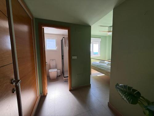 a room with a bathroom with a toilet and a doorway at Veneziola Golf II by Alina365 in La Manga del Mar Menor
