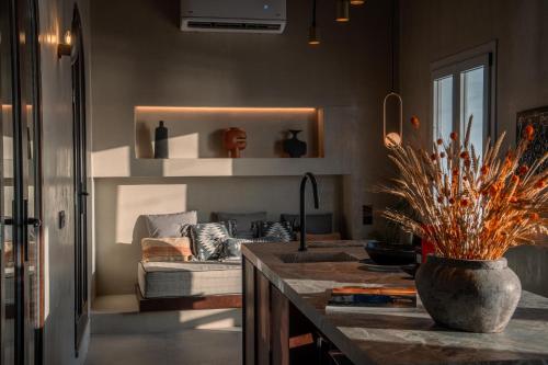 a living room with a couch and a table at Legends in Town, by Mykonos High in Mikonos