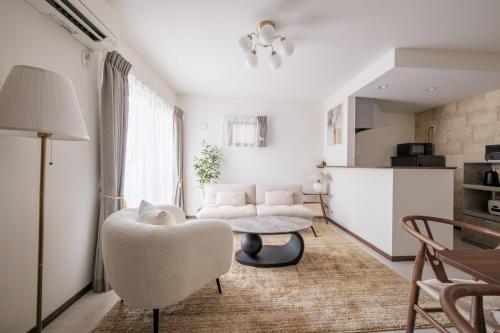 a living room with a couch and a table at Grace -Vacation stay-10min from Nagoya Free P 40m2 King Nomad in Nagoya