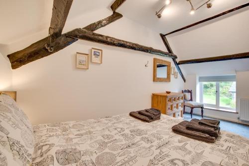 a bedroom with a bed with towels on it at 1 Bed in Parracombe oc-smitho in Trentishoe