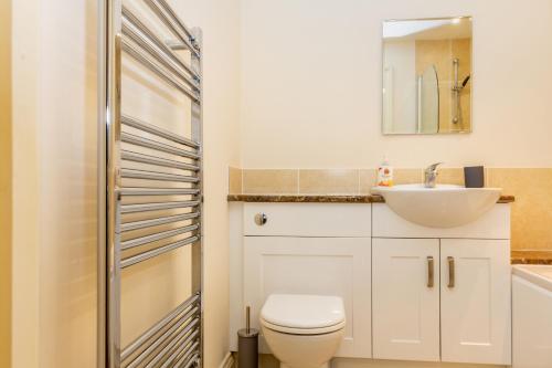 a bathroom with a white toilet and a sink at Hillbrook House 4- Malvern in Great Malvern