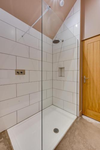 a bathroom with a shower with a glass door at 2 Bed in Holme-on-Spalding-Moor oc-vy215 in Holme upon Spalding Moor