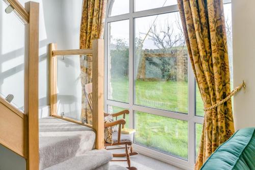 a room with a large window and a couch at 3 Bed in Askrigg oc-ds958 in Askrigg