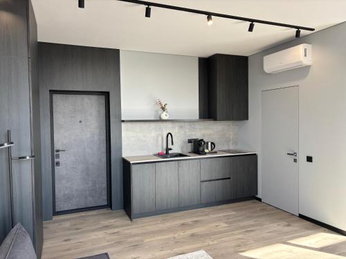 a kitchen with a sink and a counter top at Bavaro apartments 2 in Ivano-Frankivsk
