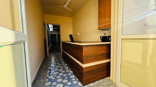 a kitchen with a counter with a laptop on it at Hotel Star Inn , Pushkar in Pushkar