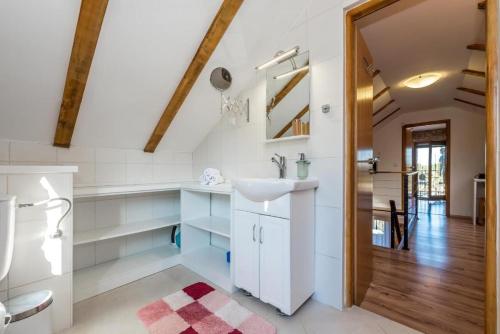 a bathroom with a sink and a toilet at Villa Rural wellness in Validžići
