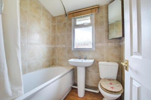 a bathroom with a sink and a toilet and a bath tub at 2 Bed in Padstow oc-p00551 in Saint Merryn